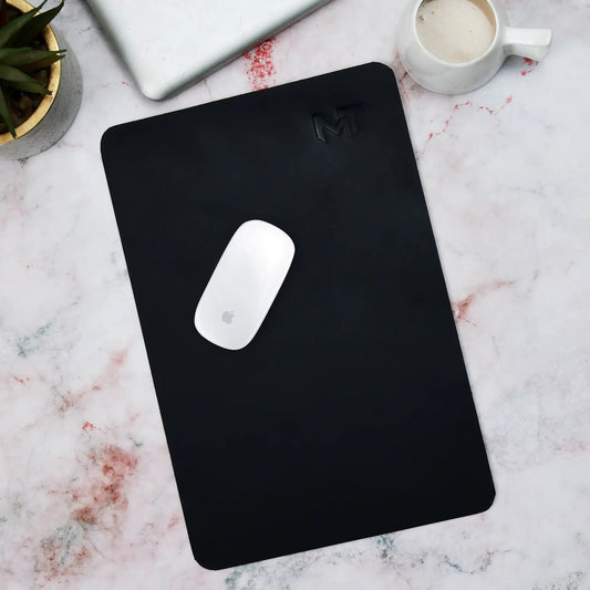 Noir Opulence black leather desk mat and mouse pad with embossed logo on marble desk on Tampa Home & Garden Store