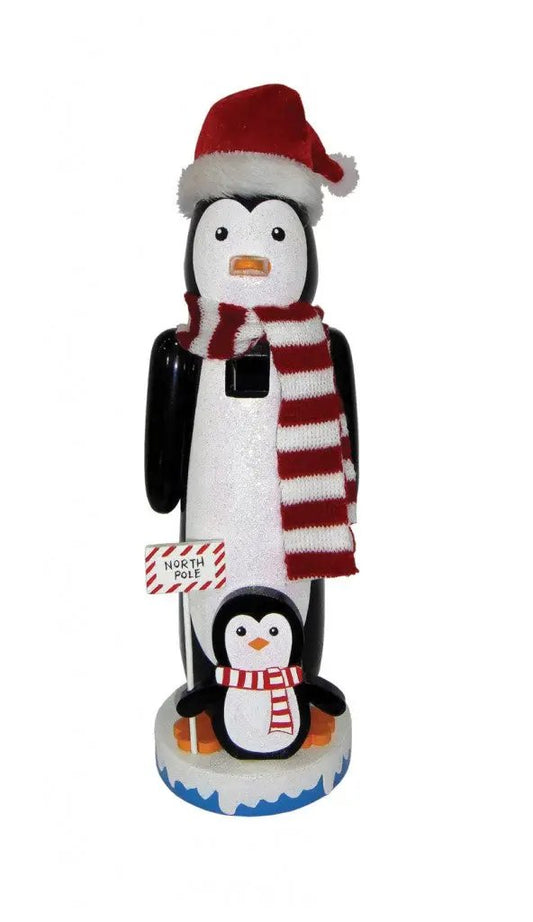 North Pole Penguin Nutcracker hand painted wood with red Santa hat and striped scarf on icy base on Tampa Home & Garden Store