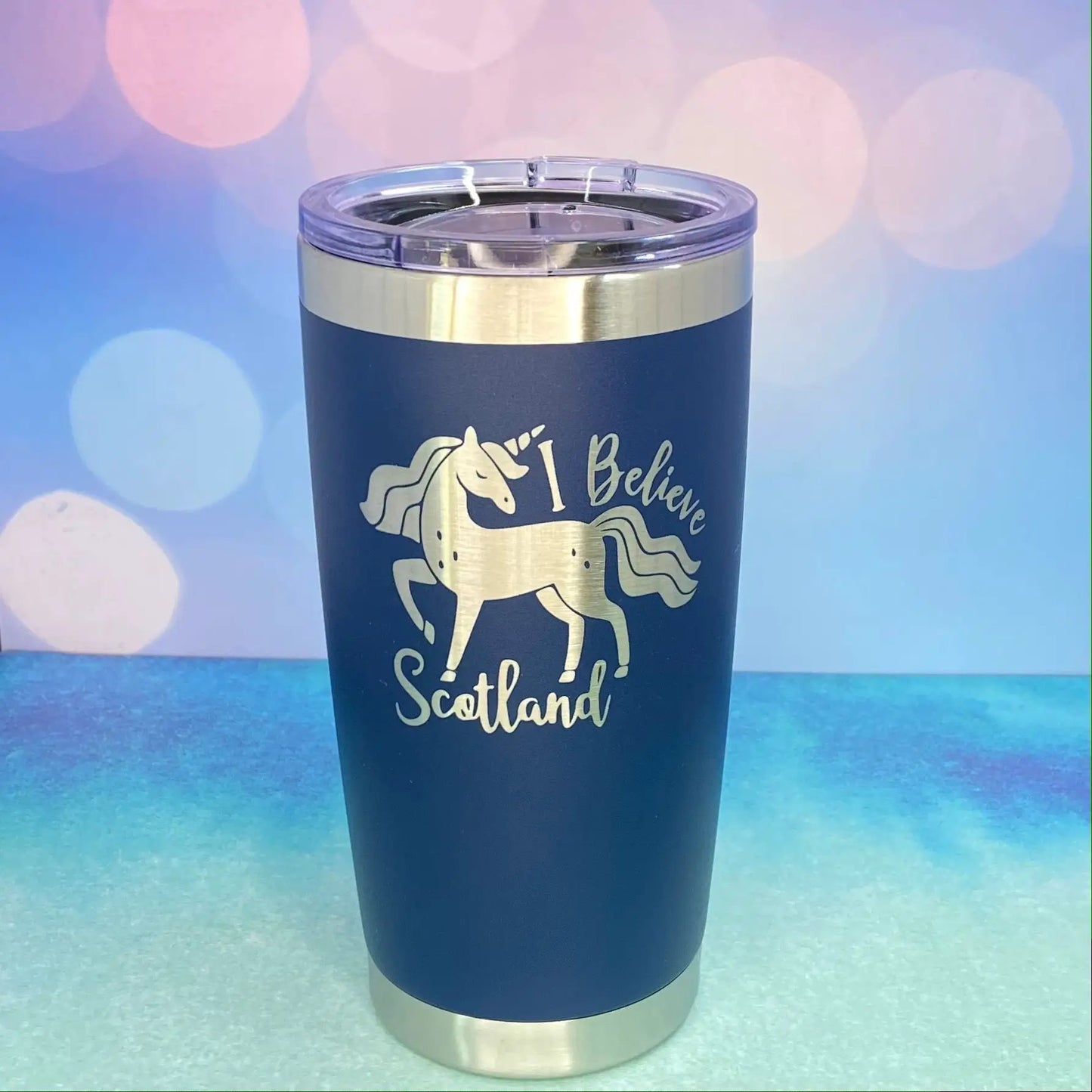 Tumbler navy powder-coated with silver band and clear lid, white unicorn Scotland graphic on Tampa Home & Garden Store