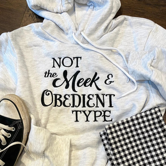 Thistle & Stitch Not the Meek and Obedient Type Sweatshirt, heather gray unisex hoodie with black script text on front on Tampa Home & Garden Store