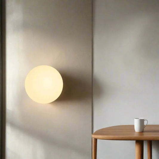Minimalist round glass wall sconce LED light, warm frosted globe by Moktan Sabai on Tampa Home & Garden Store