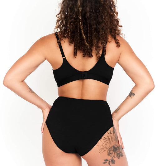 Net Positive High-Rise Hemp Briefs in black, back view on model on Tampa Home & Garden Store