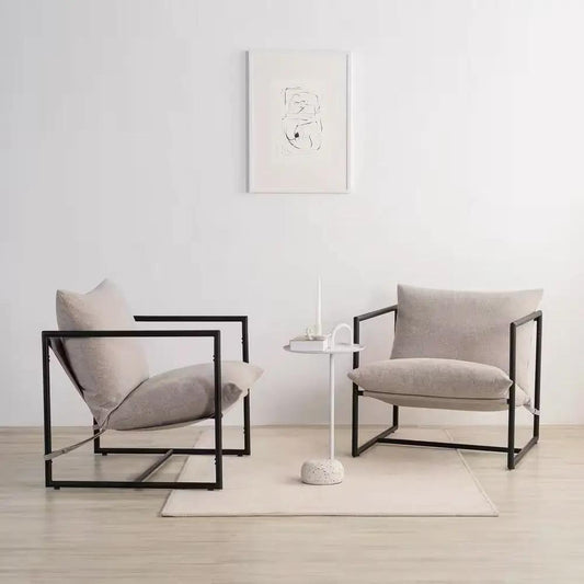 Beige upholstered accent chair with black metal frame; two cushioned chairs with a tiny side table on Tampa Home & Garden Store