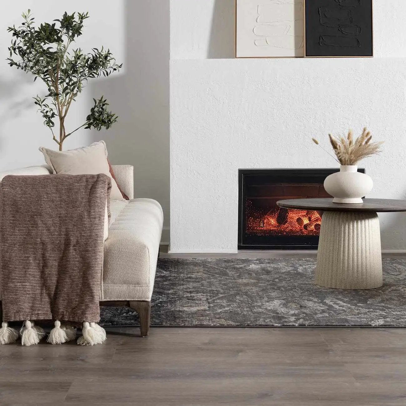 Georgiana Charcoal Area Rug with Persian Design by Boutique Rugs in a cozy living room on Tampa Home & Garden Store