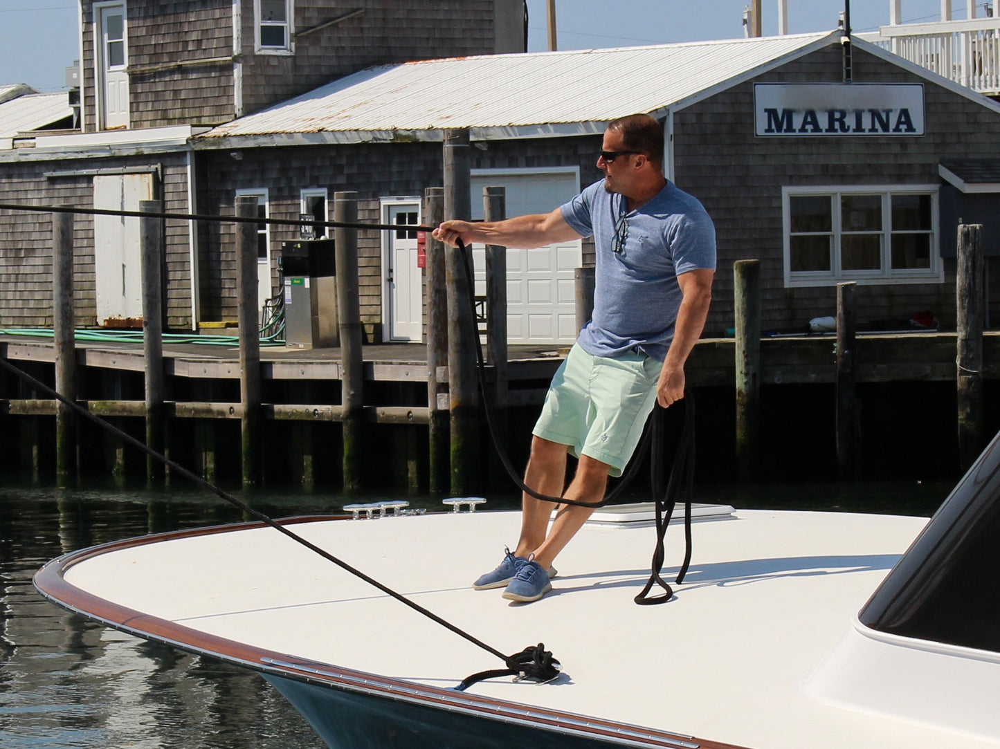 Oasis SS Tee by White Water Life, light blue short-sleeve tee worn by man at marina on Tampa Home & Garden Store