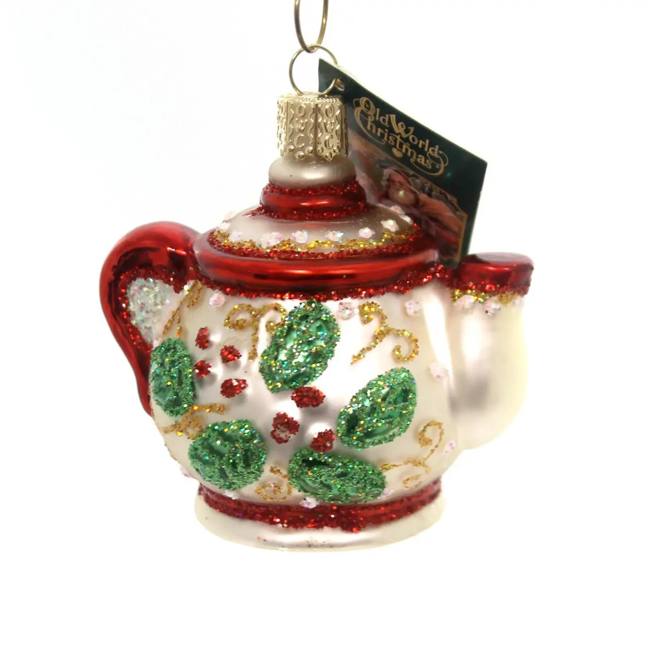 Old World Christmas Holly Teapot Ceramic ornament with red lid and glittery holly leaves on Tampa Home & Garden Store