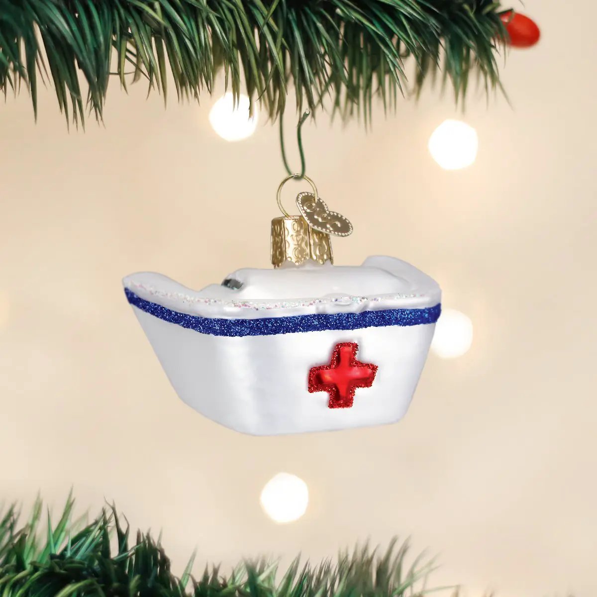 Old World Christmas Nurse's Cap Ornament nurse cap with red cross and blue glitter trim on Tampa Home & Garden Store