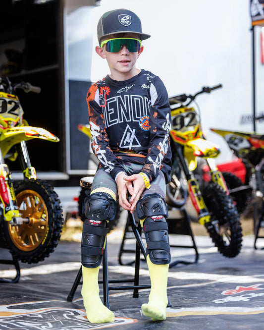 Youth knee guards with anatomical fit from EVS Sports, black pads for roller skating pair on Tampa Home & Garden Store