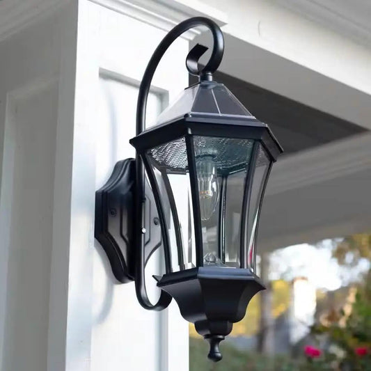 Outdoor Farmhouse Solar Wall Light in Black finish with lantern-style glass panels, wall-mounted on Tampa Home & Garden Store
