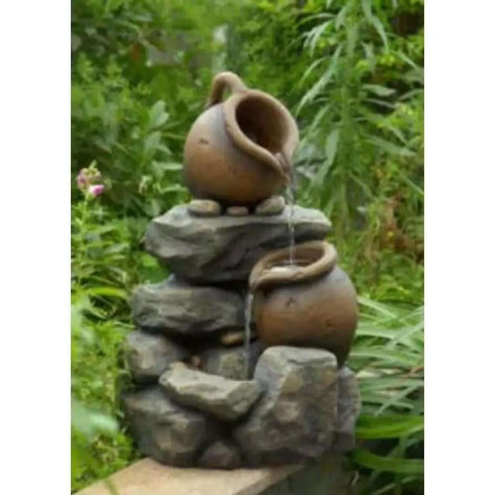Outdoor rock and pitchers waterfall fountain with pump; two terracotta pots on stacked stones on Tampa Home & Garden Store