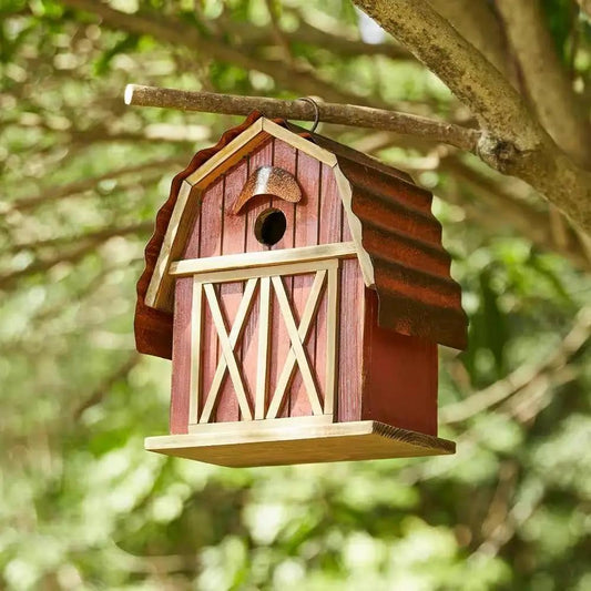Outdoor Red Wood and Metal Barn Style Bird House hanging from a tree branch on Tampa Home & Garden Store