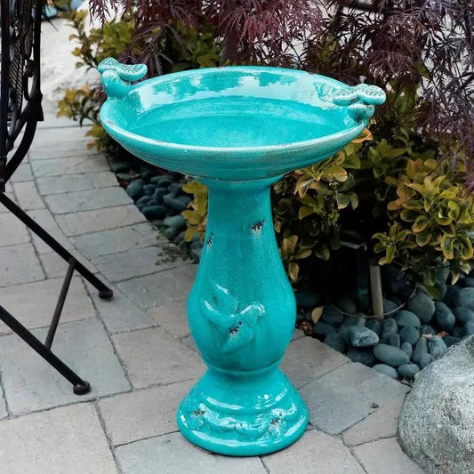 Outdoor turquoise blue ceramic birdbath on pedestal with glossy glaze on Tampa Home & Garden Store