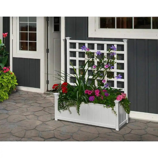 Outdoor white vinyl planter box with trellis on a porch, filled with colorful flowers on Tampa Home & Garden Store