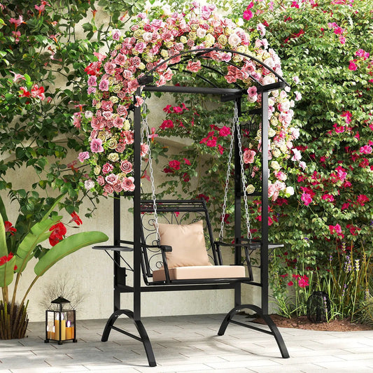 Outdoor porch swing with stand and rose-framed trellises, black metal frame, beige cushion on Tampa Home & Garden Store