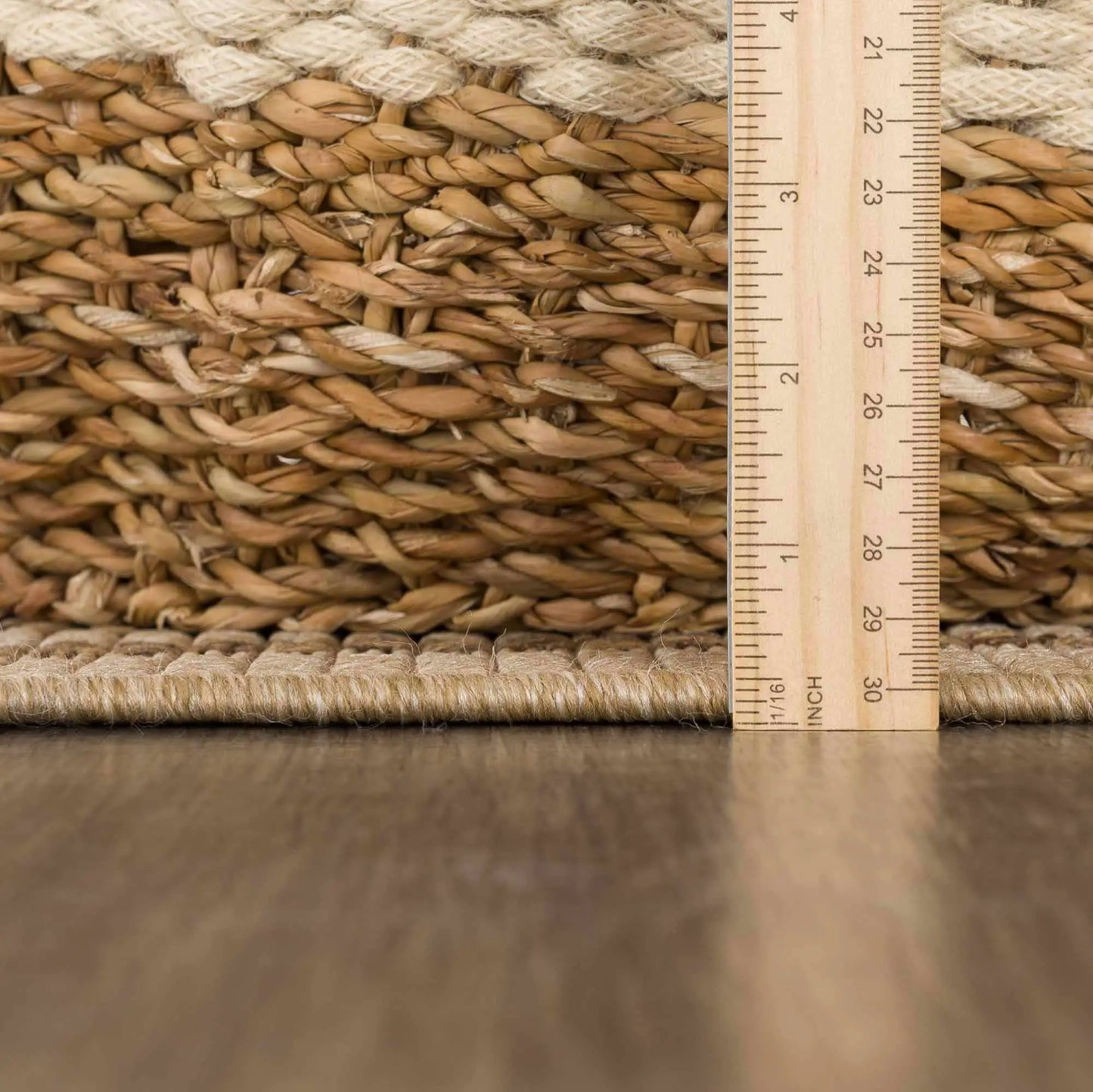 Isoko Bordered Faux Jute Outdoor Rug with natural braided texture and ruler scale on Tampa Home & Garden Store