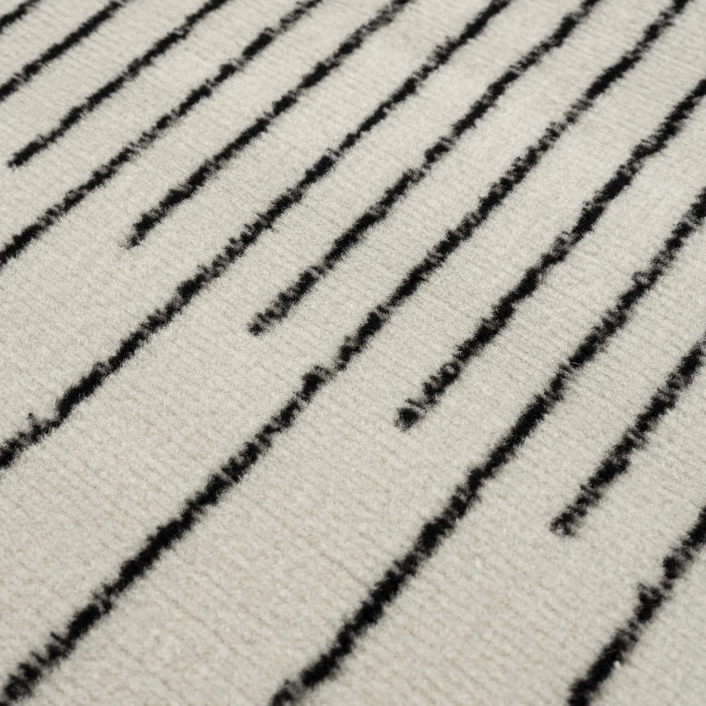 Angus Black&White Geometric Area Rug cream background with diagonal black stripes on Tampa Home & Garden Store