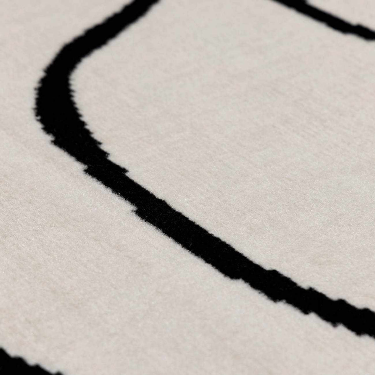 Eilir Modern Low Profile Boho Rug cream rug with bold black line pattern Boutique Rugs on Tampa Home & Garden Store