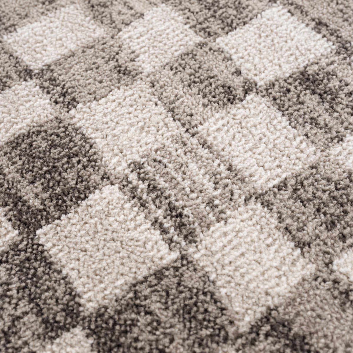 Benjy irregular checkboard beige rug, plush shag texture in beige tones on Tampa Home & Garden Store