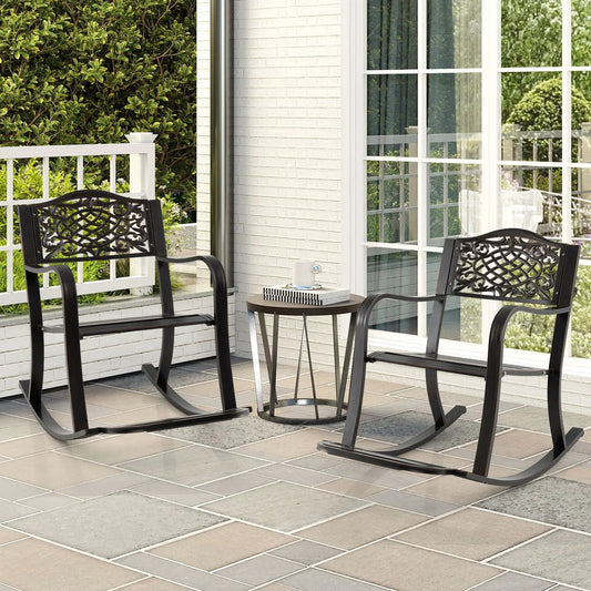 Set of two black metal patio rocking chairs with ornate lattice backs and curved armrests on Tampa Home & Garden Store