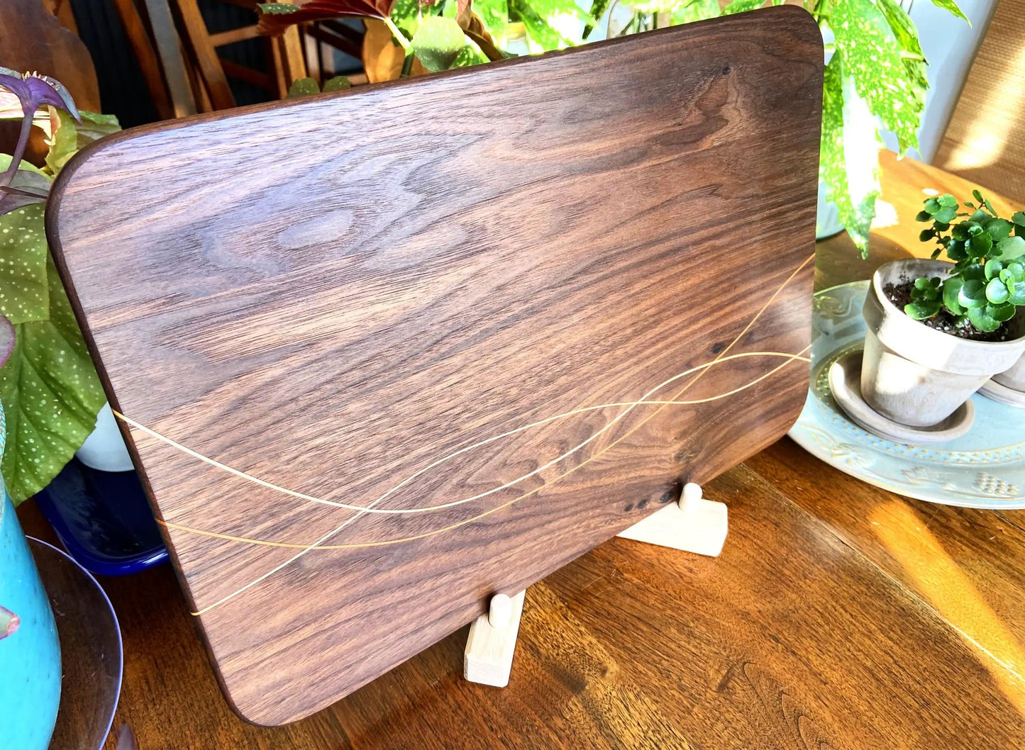 Walnut charcuterie board with maple and cherry inlay, rounded edges on Tampa Home & Garden Store