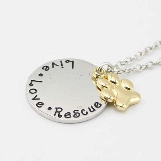 Live Love Rescue paw necklace with silver round tag and gold paw charm on stainless chain on Tampa Home & Garden Store