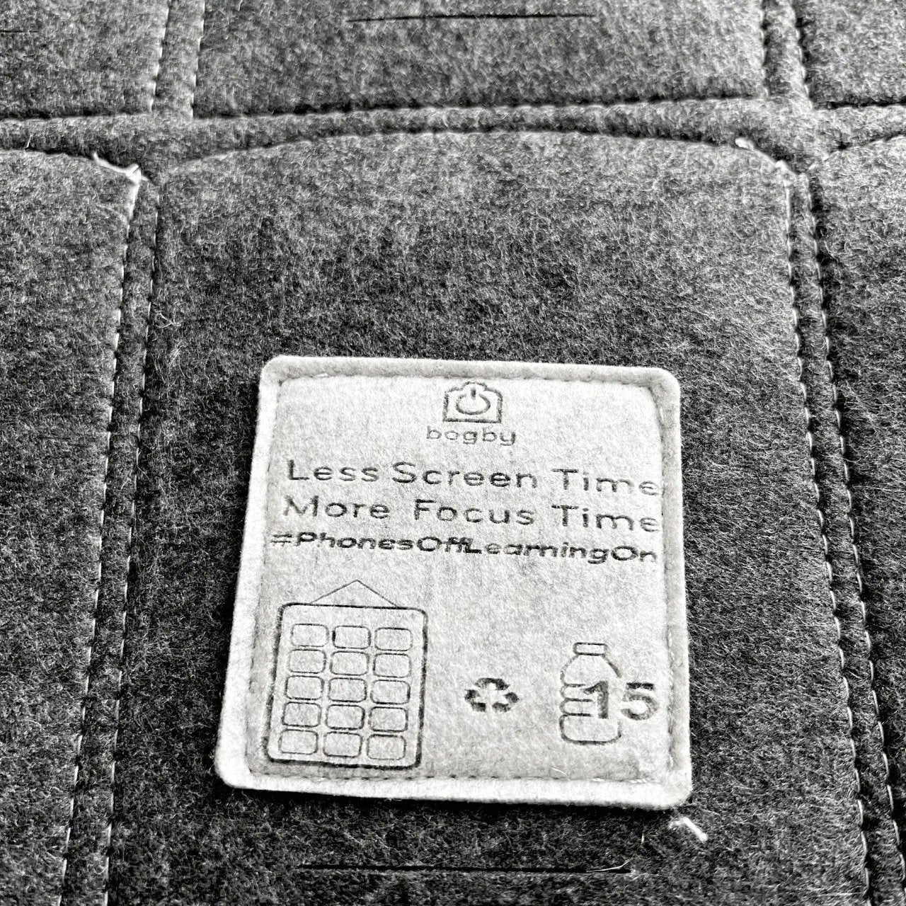 Phone organizer patch by Bagby on dark fabric displaying Less Screen Time More Focus Time on Tampa Home & Garden Store
