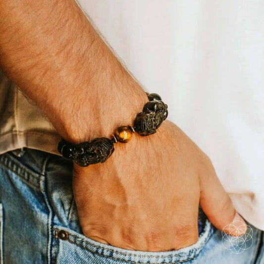 Pi Yao Wealth Bracelet with black carved beads and a gold-toned accent bead on Tampa Home & Garden Store