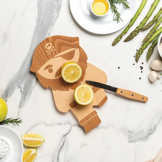 Pirate Shaped Cutting Board by OTOTO DESIGN, natural wood pirate head with lemon halves nearby on Tampa Home & Garden Store