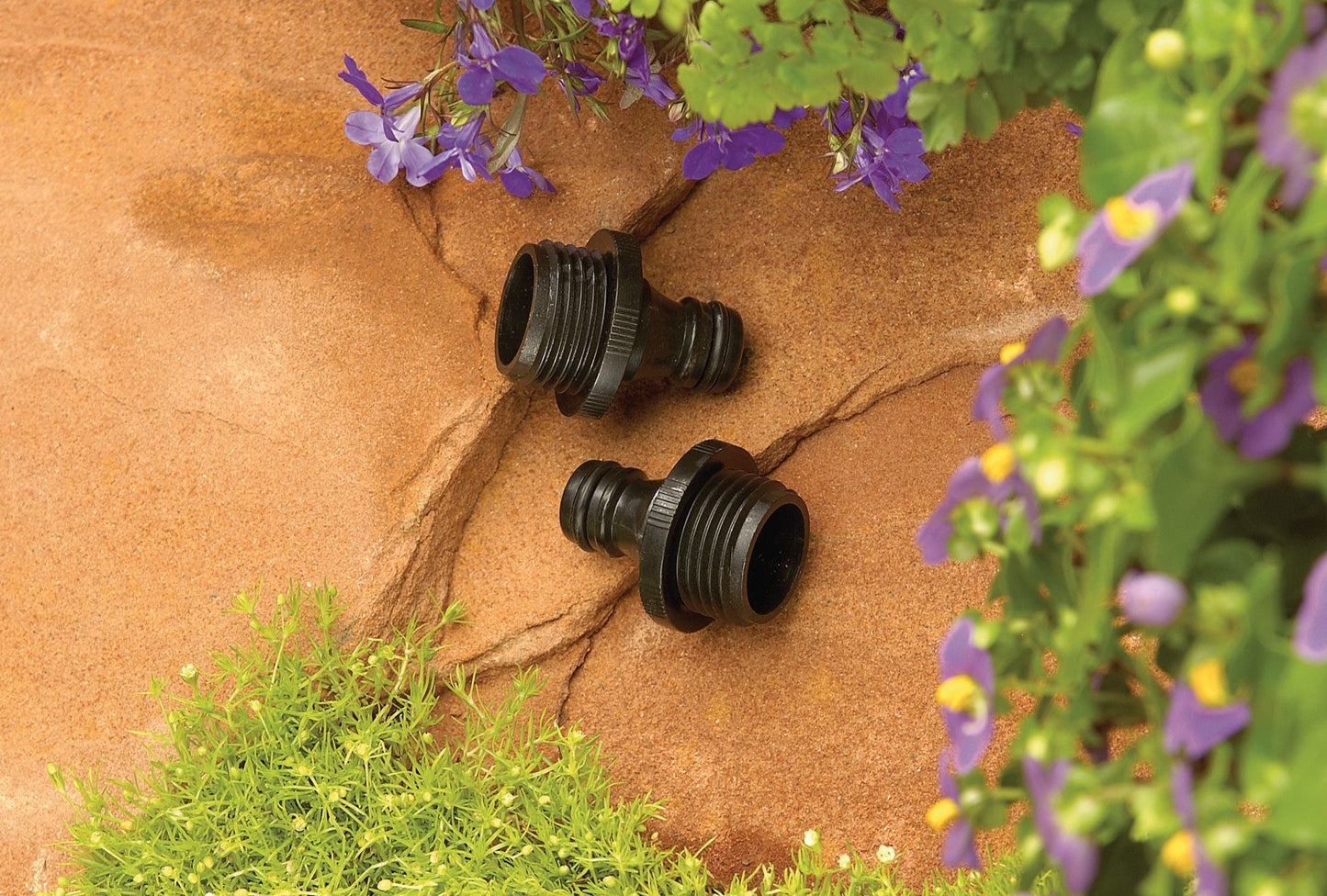 Orbit Irrigation plastic male quick-connect hose ends, 2-pack, black fittings on stone wall on Tampa Home & Garden Store