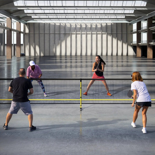 22 Feet Portable Pickleball Net with Wheels featuring black mesh and yellow frame on court on Tampa Home & Garden Store