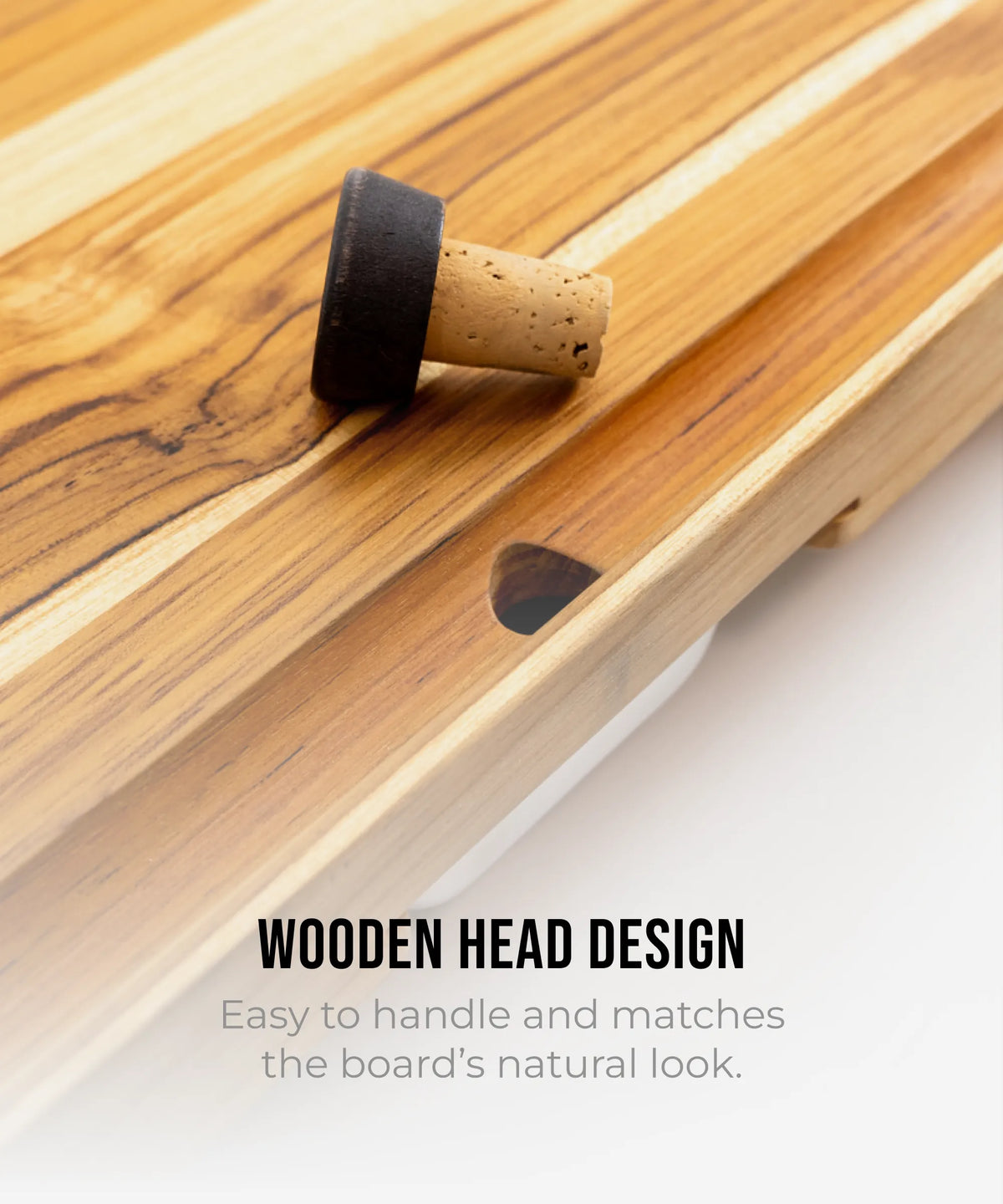 Set of 3 cork bottle stoppers with black caps resting on a wooden board on Tampa Home & Garden Store