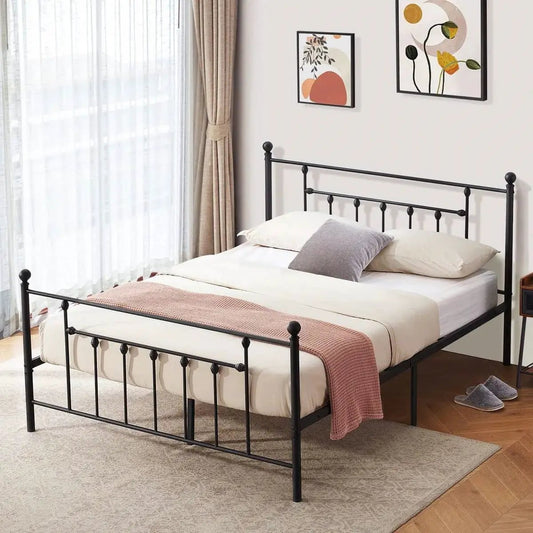 Queen size vintage style black metal platform bed frame with spindle headboard in a bedroom on Tampa Home & Garden Store