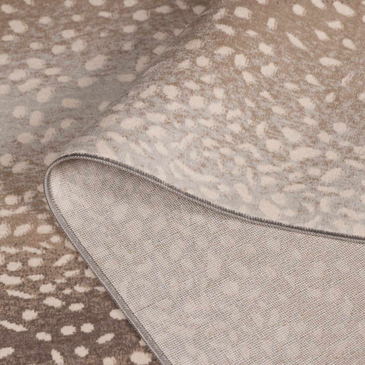 Pointblank Tan Leopard Rug by Boutique Rugs, beige tan spotted pattern with folded corner on Tampa Home & Garden Store