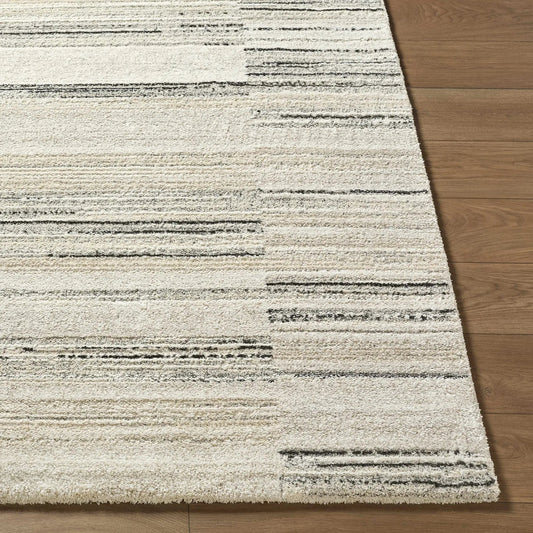 Rumer Luxe Rug in white and cream with subtle stripes on wood floor Boutique Rugs on Tampa Home & Garden Store