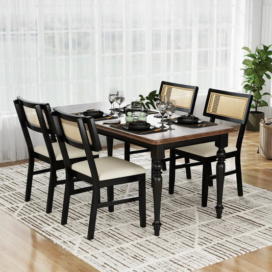 Six black dining chairs with rattan caned backs and beige fabric seats around a wooden table on Tampa Home & Garden Store