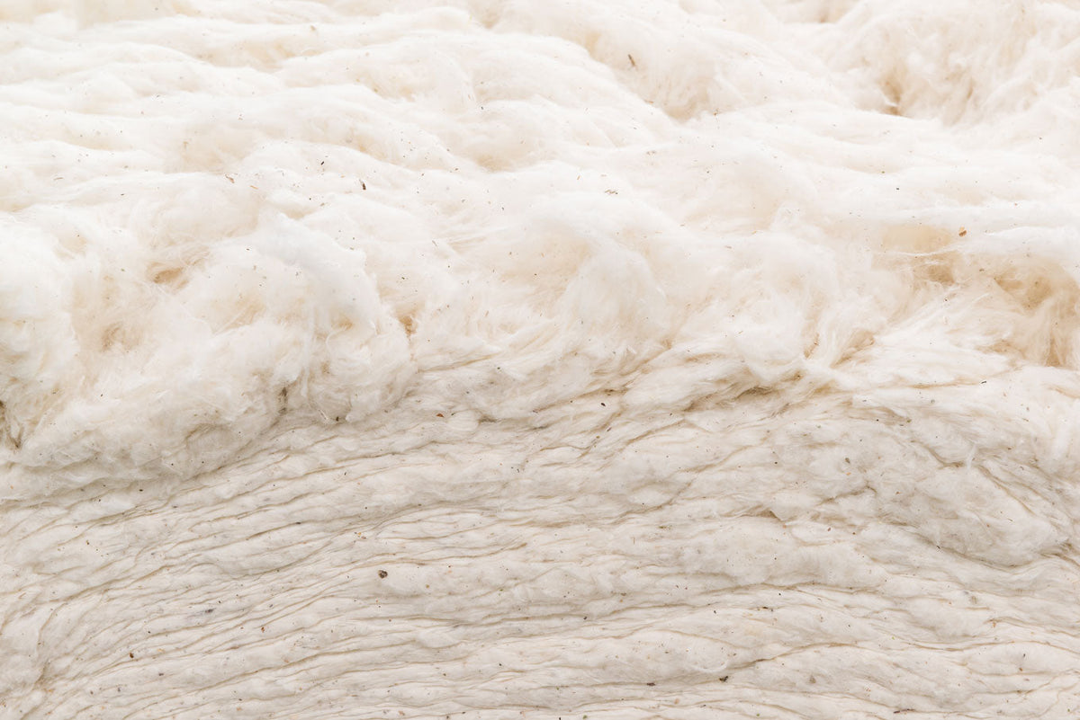 Raw cotton stuffing/batting all natural with fluffy off-white fibers on Tampa Home & Garden Store