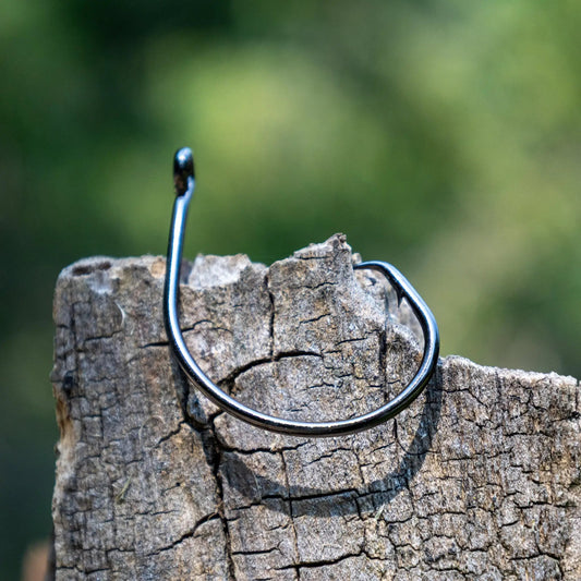 Reaction Tackle Premium Circle Hooks, steel finish, single hook on weathered wood on Tampa Home & Garden Store