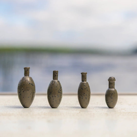 Reaction Tackle tungsten punch weights for bass, speckled gray sinkers in a row on Tampa Home & Garden Store