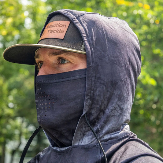 Reaction Tackle UPF 50 long sleeve hooded shirt in navy worn with face mask by model on Tampa Home & Garden Store