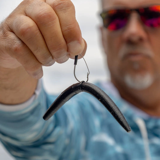 Reaction Tackle Wacky Neko Hooks 25-pack with black hooks being tied on fishing line on Tampa Home & Garden Store