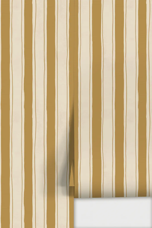 Riviera Stripe Wallpaper in off-white and mustard with vertical stripes on wallpaper sample on Tampa Home & Garden Store