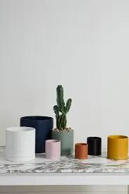 Romey Pot ceramic planters for indoor plants in assorted colors on a marble shelf on Tampa Home & Garden Store