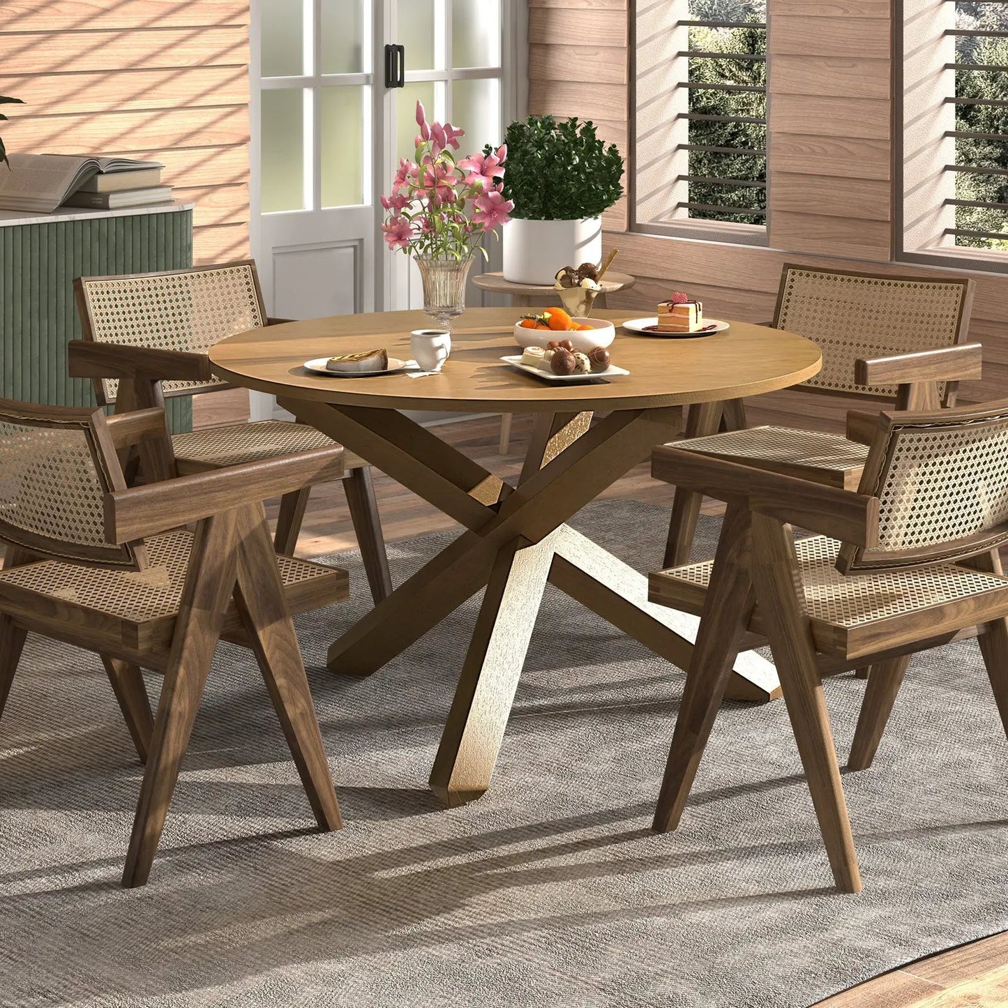 Round wooden patio dining table with four woven-back chairs on a sunlit porch on Tampa Home & Garden Store