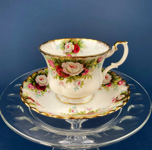 Royal Albert teacup and saucer with Celebration Motif roses, gold trim on white porcelain on Tampa Home & Garden Store