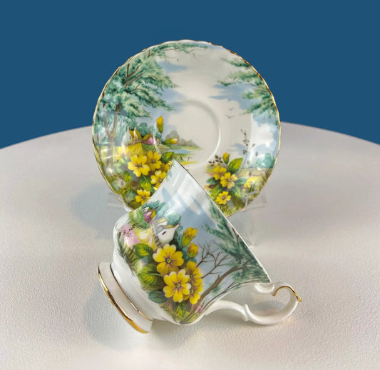 Royal Albert cup and saucer set with Primrose floral, yellow blooms on bone china gold trim on Tampa Home & Garden Store