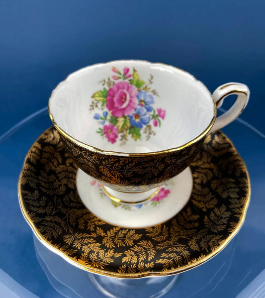 Royal Stafford teacup and saucer black with gold trim, white interior floral bouquet on Tampa Home & Garden Store