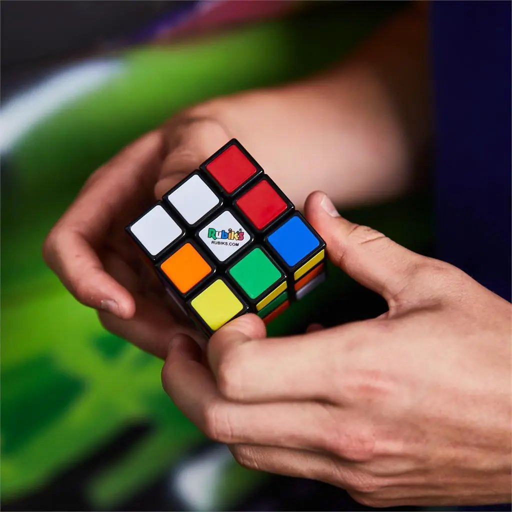 Rubiks 3x3 Puzzle Cube V10 in hands; multicolor faces with Rubiks logo visible on Tampa Home & Garden Store