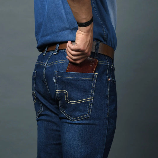 Ryan Classic Bi Fold Wallet brown leather in back pocket of denim jeans on Tampa Home & Garden Store