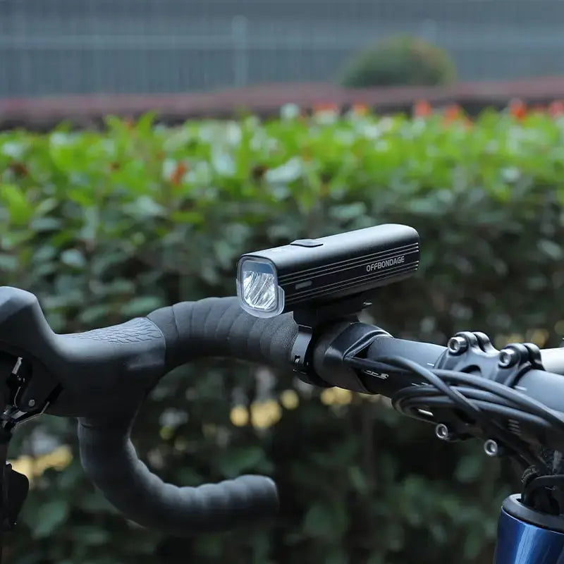 Black OFFBONDAGE 1000 Lumen USB rechargeable bike headlight mounted on handlebars on Tampa Home & Garden Store