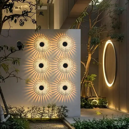 Solar Hollow Outdoor Wall Light for Front Door panel with sunburst pattern, warm glow on Tampa Home & Garden Store